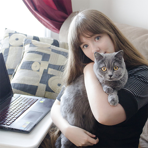 a picture of Supi holding a grey British Shorthair cat named Kuma